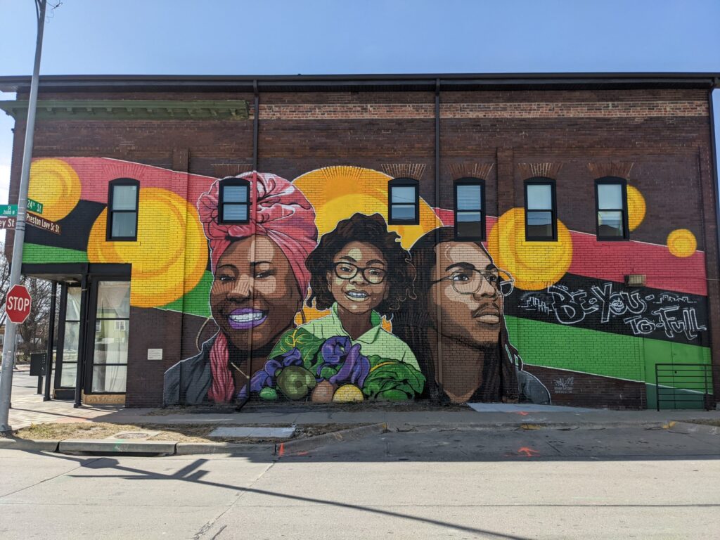 Mural in Omaha's Near North Neighborhood, "The Ancestor, The Identity, and The Seed" by Reggie Leflore.